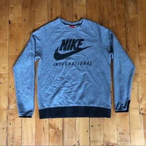 NIKE WOMENS INTERNATIONAL GREY SWEATSHIRT